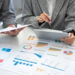 people reviwing marketing reports